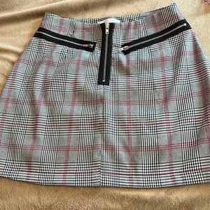 Super cute Urban Outfitters mini skirt black, red, white plaid size small.